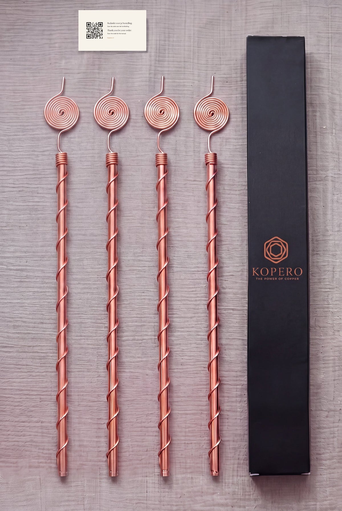 Vier Kopero Elektrocultuur antennes van 60 cm met verpakking en handleidingkaartje